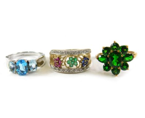 Three dress rings, comprising a 9ct gold sapphire, emerald and ruby set floral dress ring, ring size S½, a 9ct gold green top