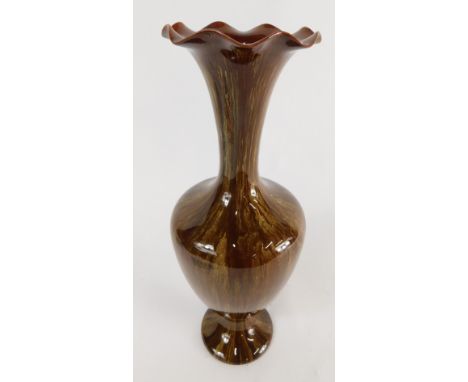 A Linthorpe pottery vase, with flared stem, shouldered body and circular foot, in brown and white glaze, impressed marks bene