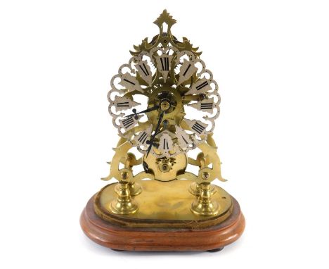 A brass skeleton clock, with 14cm wide flower head Roman numeric dial, fronting a single fusee movement, on quadruple turned 
