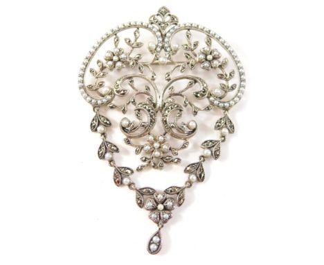 A marcasite and blister pearl Art Nouveau style pendant/brooch, of elaborate scroll floral detail, with single pin back and p