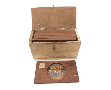 A box of various magic lantern slides, one handwritten Davis, marked Alicia in colours, 8cm wide and various others in a pine