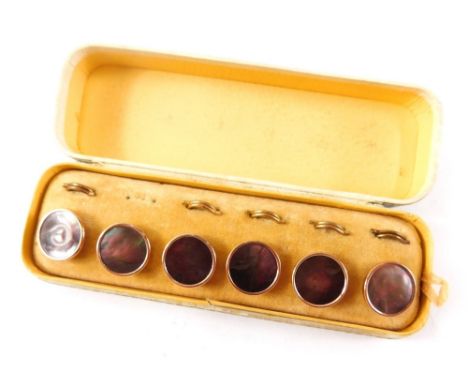 A cased set of gentleman's jewellery, comprising six mother of pearl collar studs, in gold coloured backing, boxed.