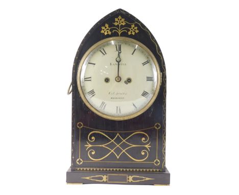 Banister, Colchester. An early 19thC ebony and brass inlaid lancet shaped mantel clock, decorated with scroll, roundels, etc.
