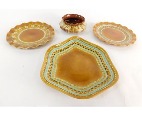 A Linthorpe pottery dish, of floral form with raised bead and triangle border, marked CD for Christopher Dresser 1585 beneath