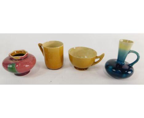 Four small pieces of Linthorpe pottery, comprising a brown glazed cup with angular handle, 8cm high, a turquoise ewer no. 150