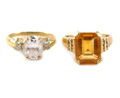 Two dress rings, comprising a 9ct gold citrine cz staggered shoulder set dress ring, ring size S, and a 9ct gold and cz set s