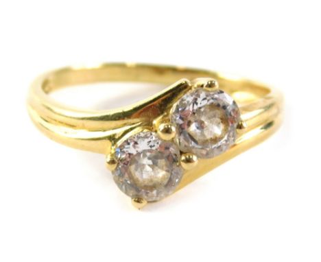 A 14ct gold cz dress rings, set with two stones on twist design, ring size U, 3.4g all in.