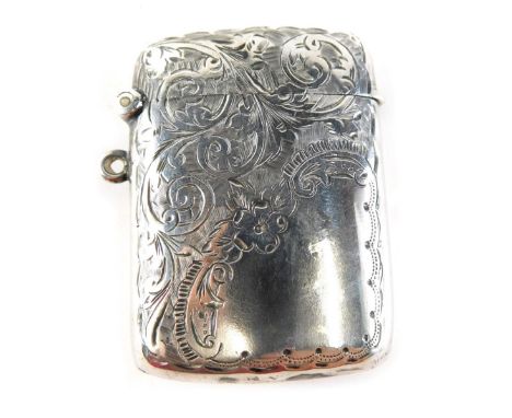 An Edward VII silver vesta case, with side ring handle, etched with scrolls and flowers with curved back, Birmingham 1906, 6c