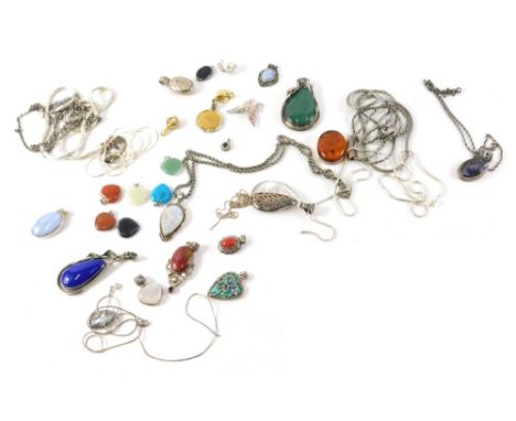 A group of silver and other pendants, mainly stone set, to include mother of pearl opal lapis, moonstone and others, some cha