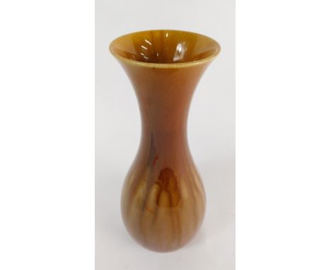 A Linthorpe pottery vase, with inverted stem and bulbous body, marked HC 124, in purple and brown running glazes, impressed m