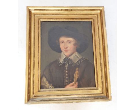 A 19th century oil on canvas portrait of a young man in 17th century costume and lace collar, holding carved statuette, 57 x 