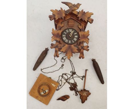 A carved wood cuckoo clock 