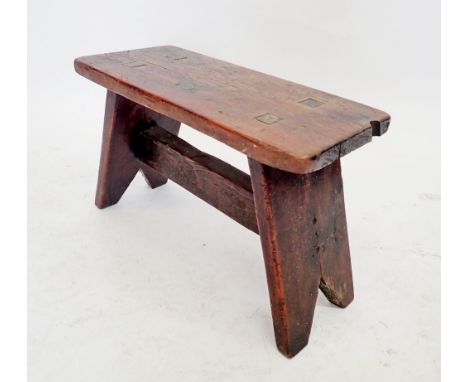 A rustic elm top low bench stool, 32m high x 49cm long 