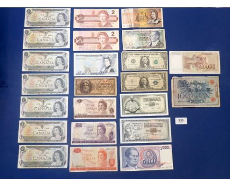 A wad of world banknotes, 22 total including examples: Australia dollar prefix: ABY, Canada: dollars (7 off) Ottawa 1973, 2 d