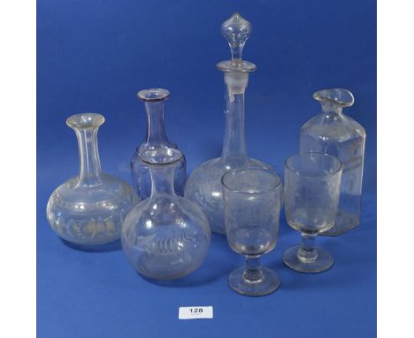 An etched glass 'Rum' decanter and four other continental decanters (lacking stoppers) plus two Victorian wine glasses etched