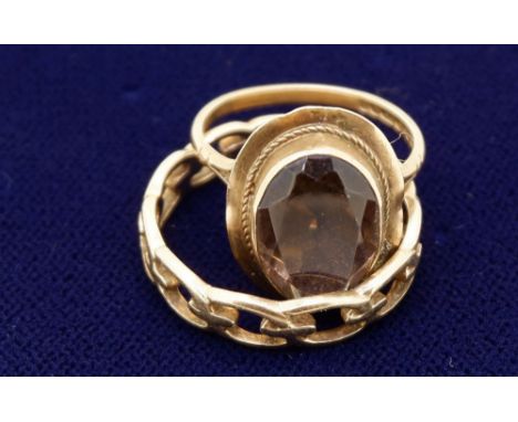 Two 9 carat gold rings: one link design, size U, 2.7g, one set with oval smoky quartz size L-M, 3.3g 