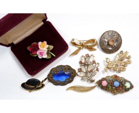 Nine brooches to include a silver Celtic  brooch with centre stone, marked sterling Scotland to rear and a boxed Royal Albert