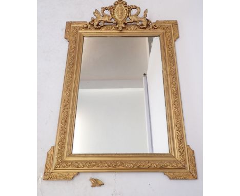 A 19th century gilt framed mirror with dragon crest, 95 x 65cm 