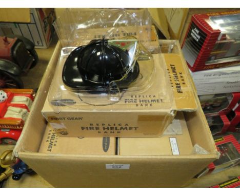 A BOX OF ASSORTED REPLICA FIRE HELMET MONEY BANKS - APPROX 10