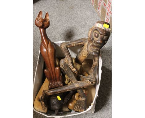 A LARGE SQUATTING INDONESIAN TRIBAL ART FIGURE, A CARVED CAT, AN INDONESIAN NIAS ISLAND HARDWOOD BUST, A LARGE LADLE AND A PA