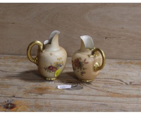 A ROYAL WORCESTER SMALL BLUSH IVORY JUG TOGETHER WITH ANOTHER - THE SECOND HAVING DAMAGES