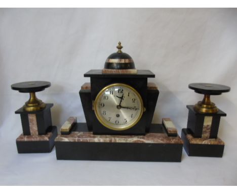 Art deco marble and slate mantle clock with a pr of garnitures