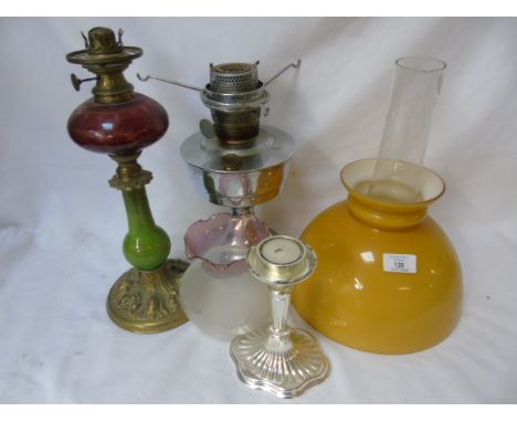 Antique brass and glass oil lamp approx. 14" tall chrome oil lamp with glass shade approx 22" tall and a plated candle holder