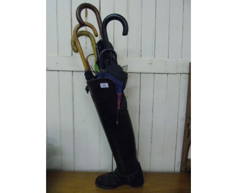 Right Cavalry offices boot stick stand complete with a collection of umbrellas