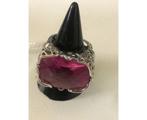 A 14k large pink stone dress ring