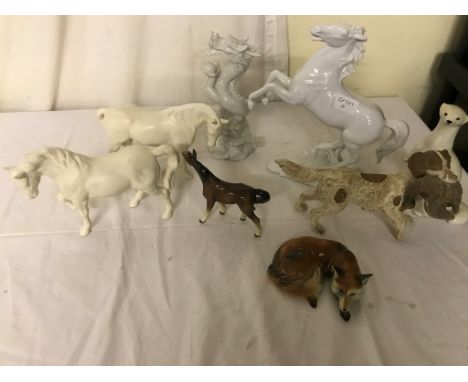 A quantity of ceramic animals to inc Beswick horses