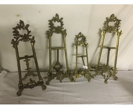 Four brass easel stands