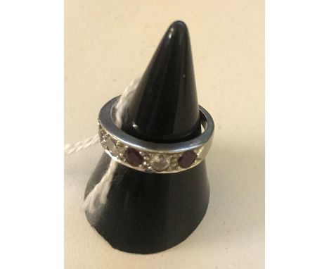 An 18ct diamond and ruby half eternity ring