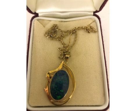 A 9ct black opal pendant on 9ct chain