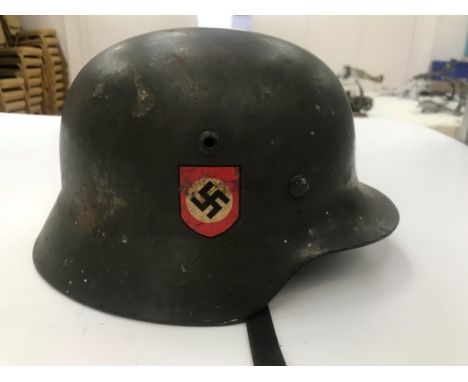 A WWII German ET 62 Double Decal Police Helmet numbered 4292 to the inside and with liner and strap