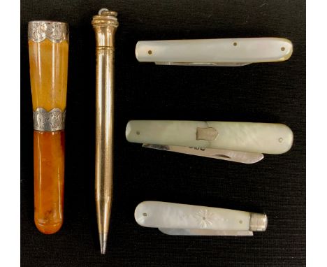 A George V silver and mother of pearl folding pocket fruit knife, Walker &amp; Hall, Sheffield 1923; another, Sheffield 1907;
