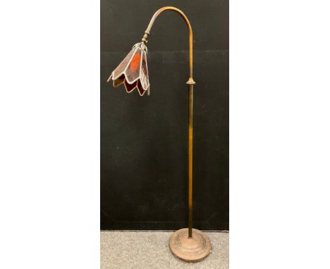 A bronze effect standard lamp, amber glass shade, 152cm high
