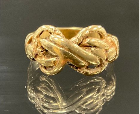 An unmarked yellow metal double knot signet ring, size R, 4.7g gross