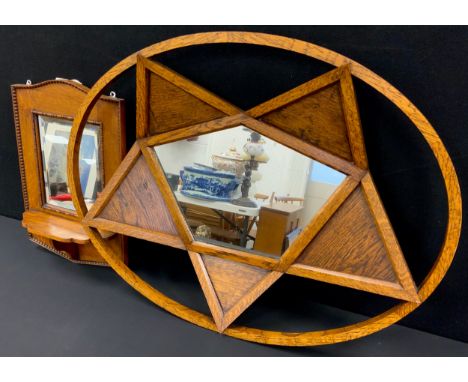Interior design - An interesting mid-century mirror, of concave star-shape, within an oval, 84cm x 65cm; another Arts and Cra