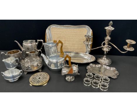 Plated ware - A Piquot ware, four piece tea set on tray; candelabrum, bread dish, Victorian three piece tea set;  etc.