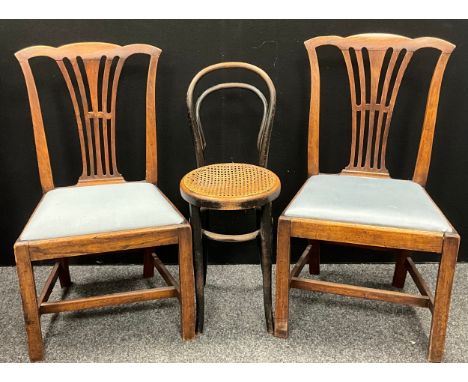 A pair of chippendale style oak dining chairs, 94cm high, 51cm wide, 37cm seat depth; a bistro bentwood style chair with cane