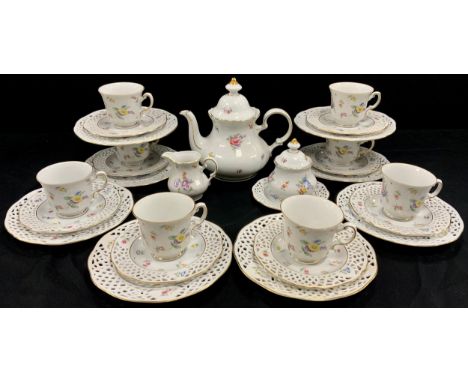 Burg Lindan porcelain tea service for eight comprised of; a tea pot, milk jug, sugar pot, eight floral tea cups and saucers, 