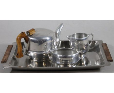 A Picquot Ware part service, comprising tray, 44cm wide, teapot, milk jug and two handled sugar bowl.  