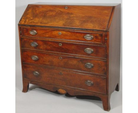 A Georgian flame mahogany bureau, the flap top to reveal a fitted interior over four graduated drawers on splayed bracket fee