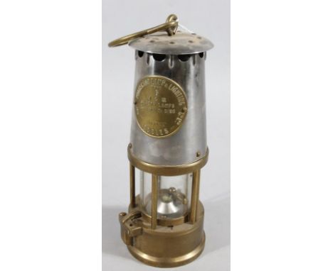 An Eccles Protector miner's lamp, number 6, of cylindrical outline, 26cm high.