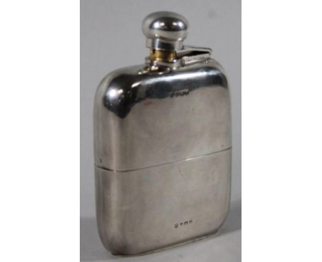 A George V silver hip flask, by C S Green & Co, of cushioned rectangular form, with detachable lower section with gilt interi