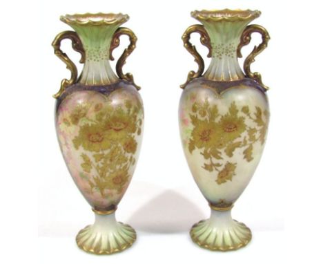 A pair of Edwardian Carltonware vases, each with compressed flared necks, bulbous bodies gilt highlighted with flowers on flo