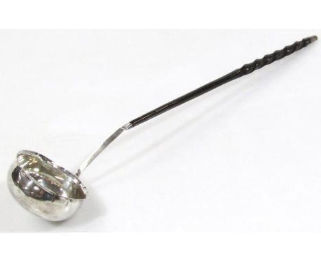 A George III ladle, with partially turned whale bone handle with white metal tip and bowl, 30cm wide.