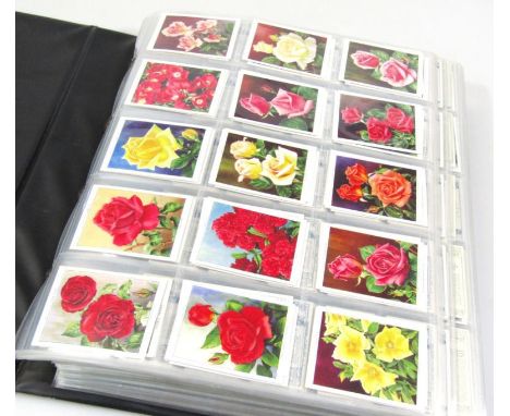Various cigarette cards, to include Wills, Wild Flowers, Strange Craft, Safety First, Roses, etc. (1 album)