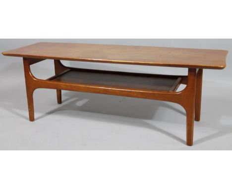 a 1970's Mackintosh style teak coffee table, the shaped top with under shelf on shaped supports, 41cm high, 116cm wide, 41cm 