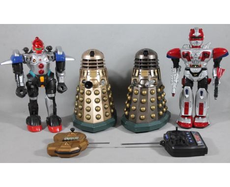 Four various remote controlled plastic toys, comprising two Daleks, 35cm high, and two robots, with RC6 first remote control,